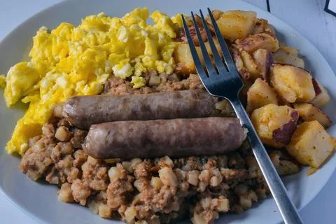 Scrambled eggs with corn beef hash Stock Photos