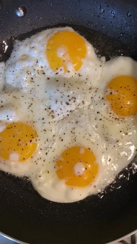 Scrambled eggs in a frying pan Stock Footage 239167249