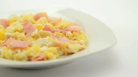 Scrambled eggs with ham Video stock 10821131