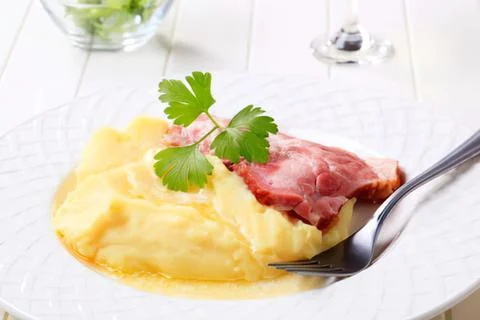 Scrambled eggs with ham garnished on a fork Stock Photos