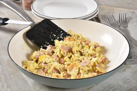 Scrambled eggs with ham Stock Photos