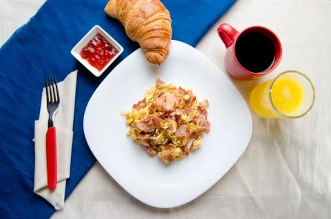 Scrambled eggs with ham Stock Photos
