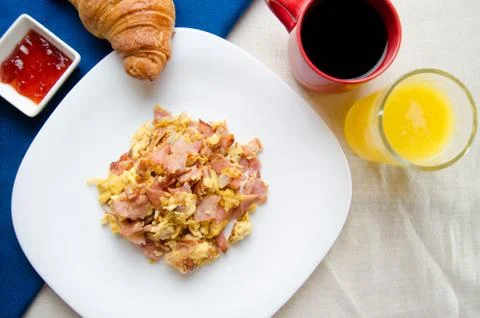 Scrambled eggs with ham Stock Photos