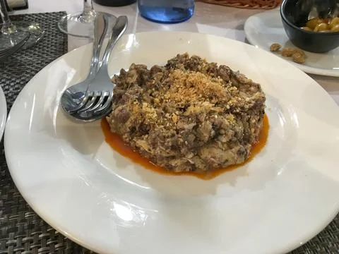 Scrambled eggs of iberian black pudding with cheese and honey Stock Photos
