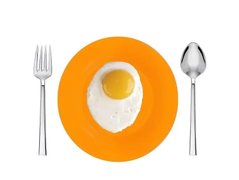 Scrambled eggs with on orange plate with spoon and fork Fotos Stock