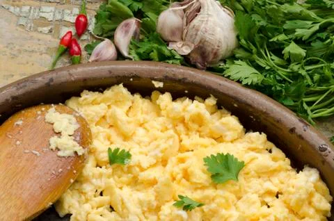 Scrambled eggs with parsley Stock Photos