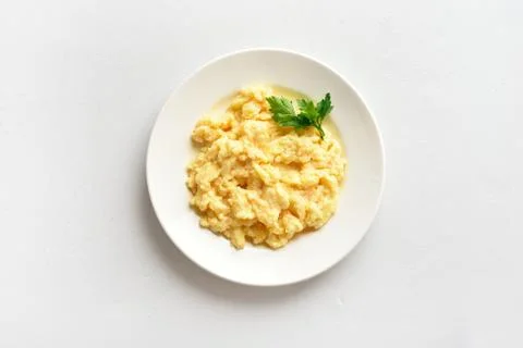Scrambled eggs on plate Stock Photos