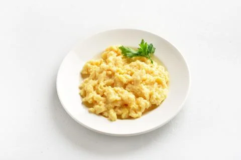 Scrambled eggs on plate Stock Photos