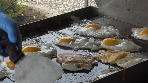 Scrambled eggs, the process of cooking on a large stove. Stock Footage 93436250