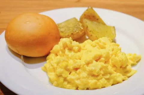 Scrambled Eggs with Round Bread Stock Photos