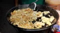 Scrambled eggs on sale on the streets of Bangkok, Thailand HD Footage