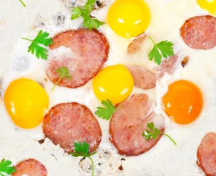 Scrambled eggs with sausage Stock Photos