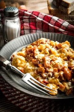 Scrambled eggs with sausage. Stock Photos