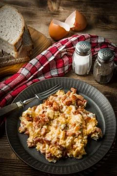Scrambled eggs with sausage. Stock Photos