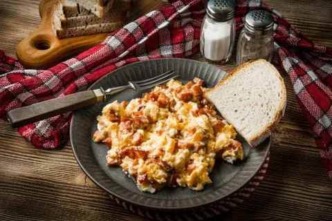 Scrambled eggs with sausage. Stock Photos