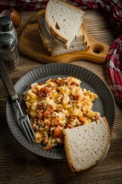 Scrambled eggs with sausage. Stock Photos