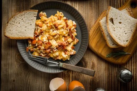 Scrambled eggs with sausage. Stock Photos