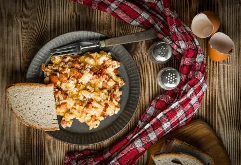 Scrambled eggs with sausage. Stock Photos