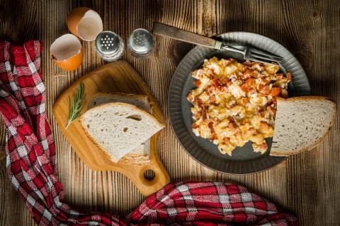 Scrambled eggs with sausage. Stock Photos