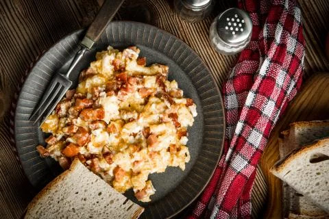 Scrambled eggs with sausage. Stock Photos
