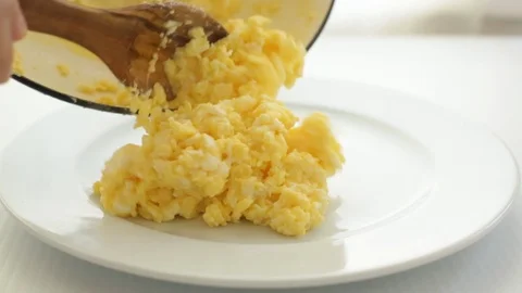 Scrambled Eggs Served on a White Plate Stock Footage 86778567
