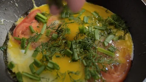 Scrambled eggs sprinkled with dill Stock Footage 93386900