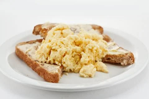 Scrambled eggs on toast Stock Photos