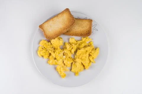 Scrambled eggs with toast Stock Photos