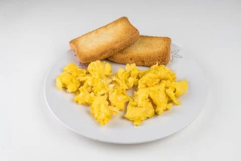 Scrambled eggs with toast Stock Photos