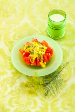 Scrambled eggs in tomato Stock Photos