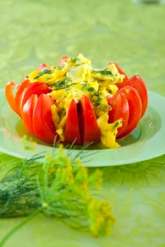 Scrambled eggs in tomato Stock Photos