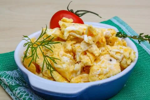 Scrambled eggs with tomato Stock Photos