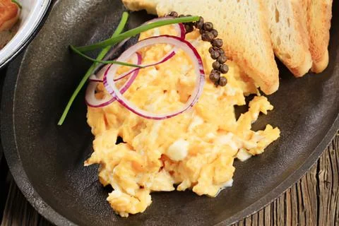Scrambled eggs with toppings on a plate Stock Photos