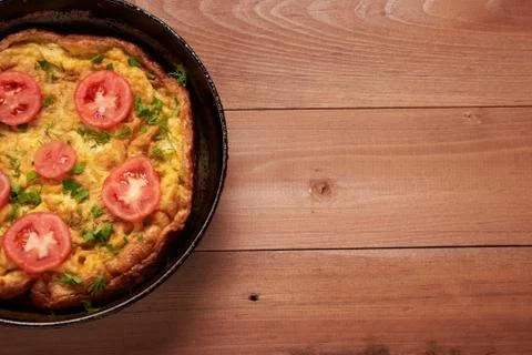 Scrambled eggs on a wooden table Stock Photos