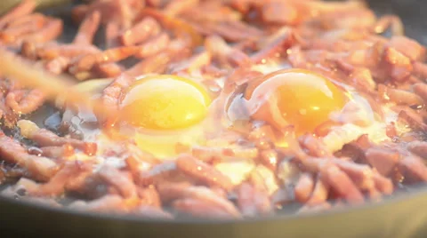 Scrambled organic eggs and fried bacon Stock Footage 34279132