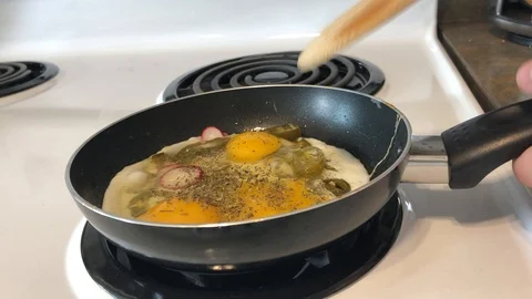 Scrambling eggs Stock Footage 118388560