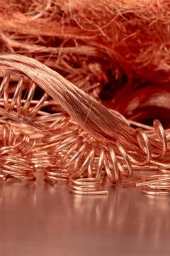 Scrap copper wire on metallic surface, raw materials metals industry Stock Photos