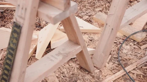 Scrap Lumber and Wood Chips at Cutting Station on Construction Site Stock Footage 345237624