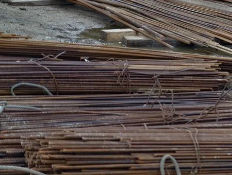 Scrap rebar in yard environment, rusty metallic rebars bundled and prepared for Stock Photos