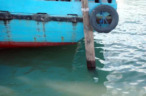 Scrap tires on the timber ship as a shield barrier collision 스톡 사진