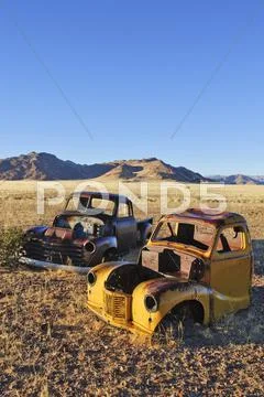 Scrap Vehicles At The Edge Of The Desert, Naukluft Mountains At Back, Republi