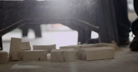 Scrap wood falling on floor after being cut. Stock Footage 53288664