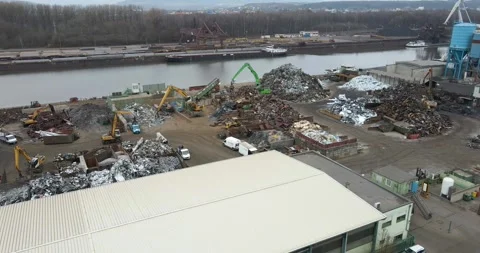 Scrap Yard On Riverside With Material Handlers, Metal Heaps, Aerial Drone View Vídeo Stock 340644141