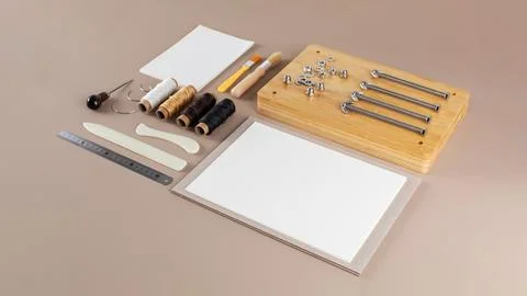 Scrapbooking kit with threads brushes and cutting tools Stock Photos