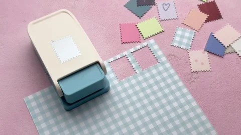 Scrapbooking process using a postage stamp craft punch Stock Footage 332892162
