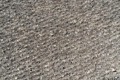 Scraped old road surface  coarse texture of a milled road reveals stone agg.. 写真素材