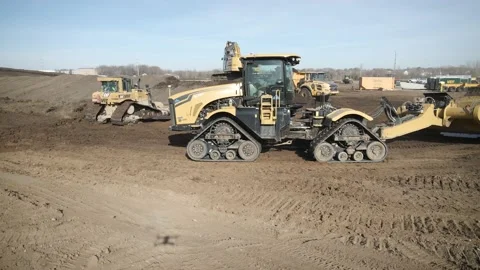 Scraper Drives Through Active Construction Site Stock Footage 145377942