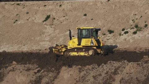 Scraper machine at work to level the river bed 動画素材 154875175
