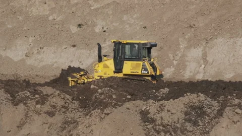 Scraper machine at work to level the river bed 動画素材 154875536