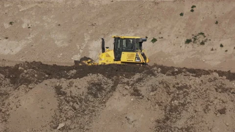 Scraper machine at work to level the river bed 動画素材 154875624
